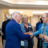 Dan Terpsma shaking hands with other event guest